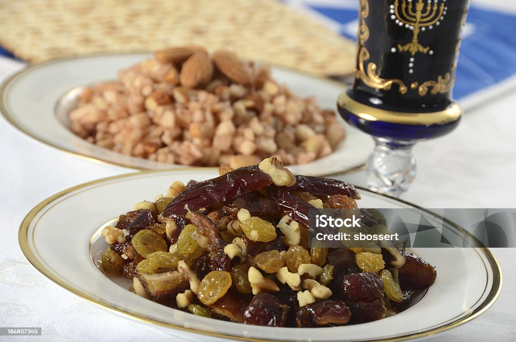 Passover Charoset "A Sephardic charoset made of dates, raisins, and walnuts, used in the Passover seder. In the background is a traditional Ashkenazi charoset of apples, nuts, cinnamon, and wine.More Passover images:" Apple - Fruit Stock Photo