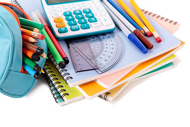 School supplies stacked on white background "Various school supplies including notebooks, calculator and pencil case isolated against a white background. Alternative version shown below:" picture of protractor stock pictures, royalty-free photos & images