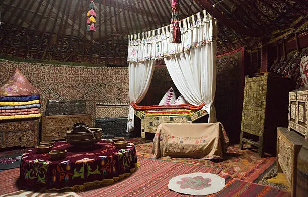 Inside of a traditional turkic yurt tent which is a portable, bent dwelling structure traditionally used by nomads in the steppes of Central Asia. Yurts have been a distinctive feature of life in Central Asia for at least three thousand years.