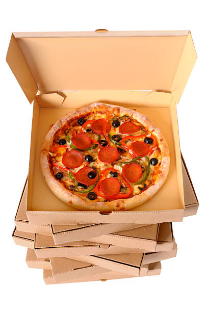 Freshly baked Pizza with stack of delivery boxes