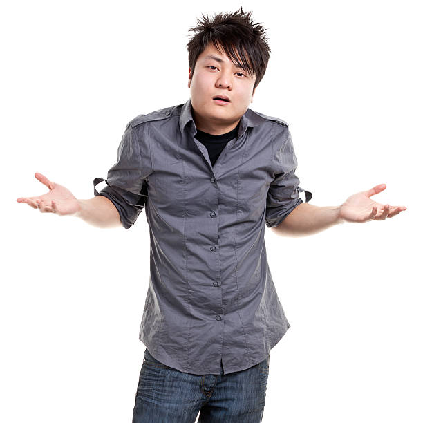 istock A young man with hands out confused 186808393