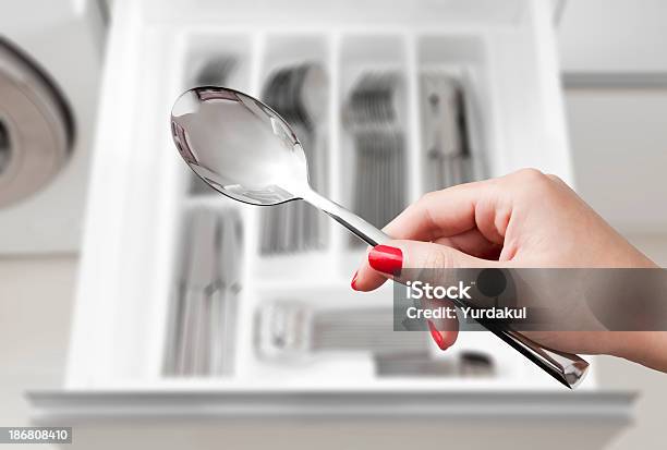 Female Hand Holding Spoon Over Silverware Drawer Stock Photo - Download Image Now - Domestic Kitchen, Domestic Life, Domestic Room