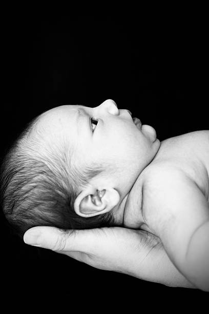 istock Newborn Baby in Mother's Hand 186808942