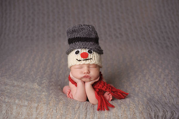 istock Newborn Sleeping in Snowman Hat 186809127