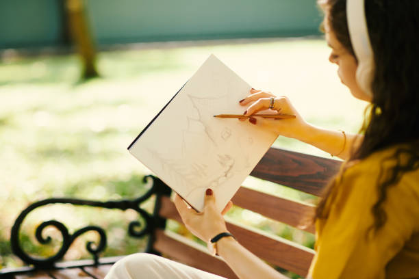 istock Inspired Woman Drawing Sketch 1868091861