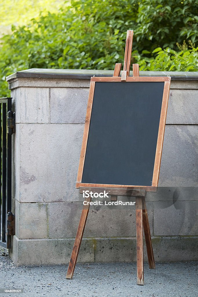 Menu board Blank menu board by entrance in summer. Cafe Stock Photo