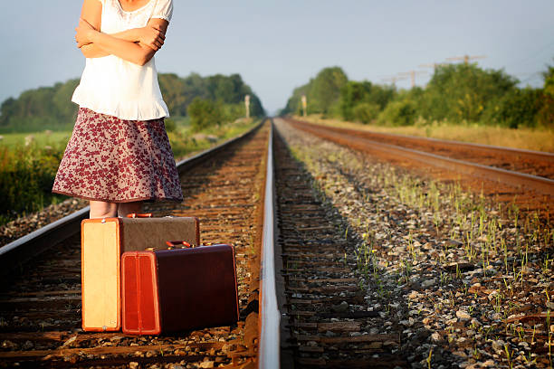 istock Woman waiting on a railroad track 186809548