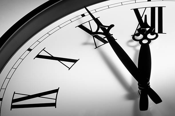 istock Traditional clock face with roman numerals almost at 12 186809828