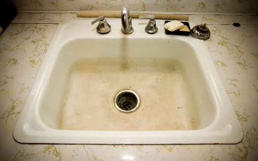limestone accumulated faucet or water tab, efflorescence stain on old and dirty water tap on the sink in toilet