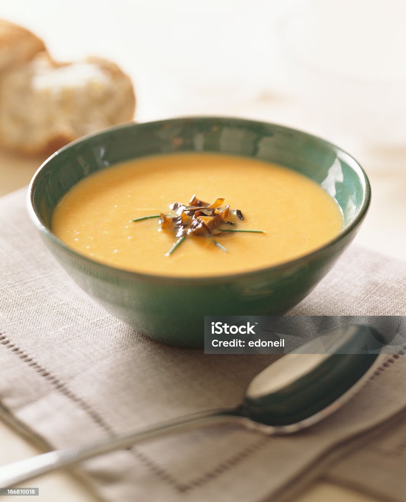 A bowl of garnished cream of squash soup Cream of squash soup Appetizer Stock Photo