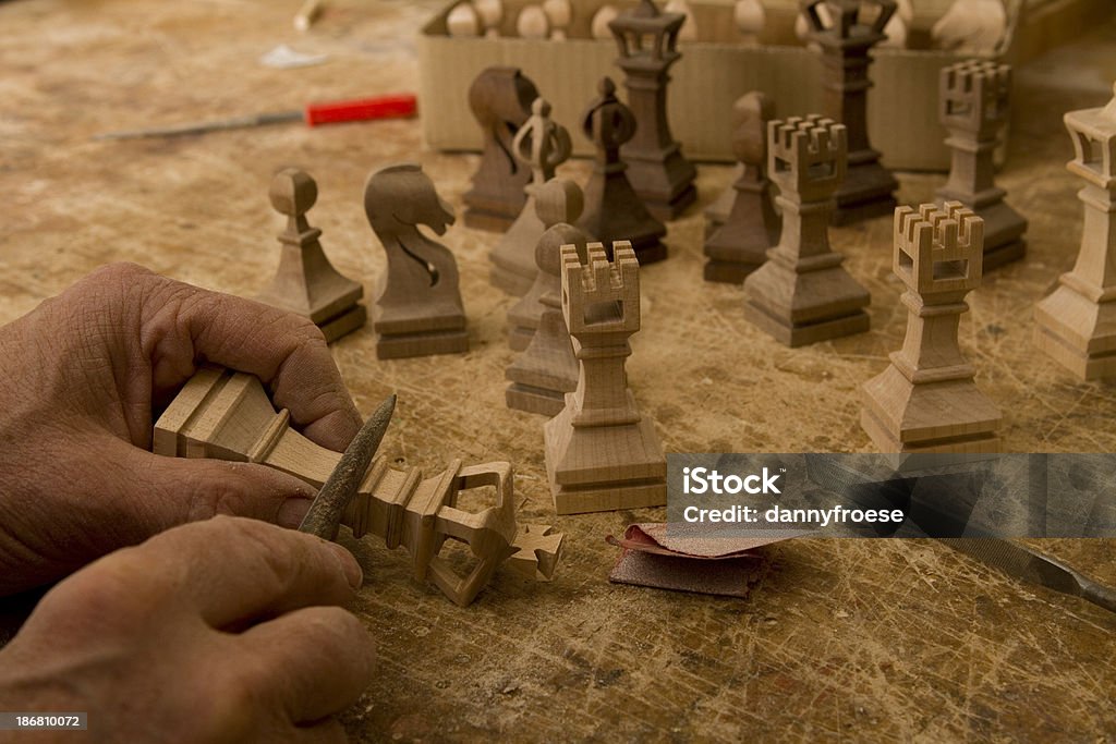 Craftsman Making a King Chess Piece Chess Stock Photo