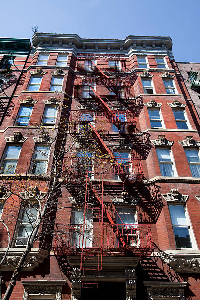 istock Fire Escapes on Old Apartment Buildings 186810279