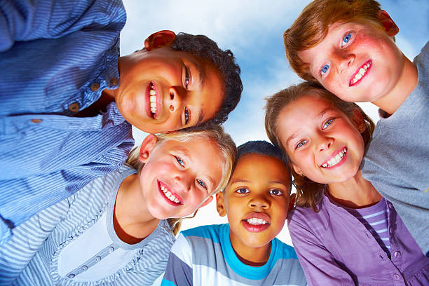 istock Low angle view of children smiling 186811112