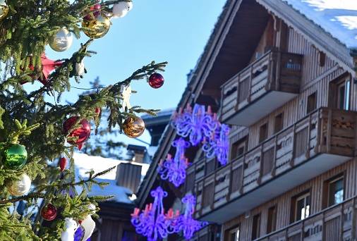 Christmas tree and chalet view by winter