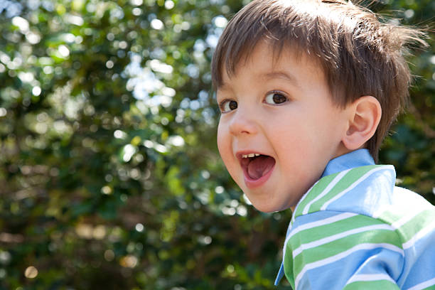 Happy Young Boy Surprised with Mouth Open.