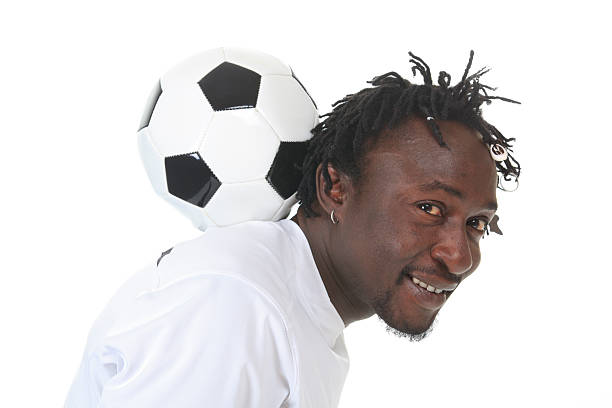 istock African Soccer Player - Ball on Back 186811581