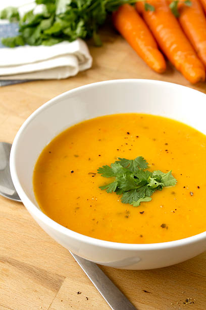 Carrot and coriander soup stock photo