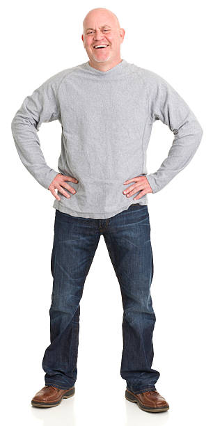 Laughing Standing Man Portrait of a mature man on a white background. http://s3.amazonaws.com/drbimages/m/cc2.jpg white long sleeve shirt stock pictures, royalty-free photos & images
