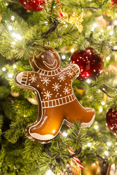 istock Christmas tree decoration, ginger man, close up, colourful and beautiful lights 1868125264