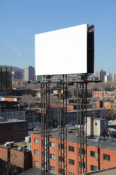 Commercial sign on top of Montreal city building  buzbuzzer montreal city stock pictures, royalty-free photos & images