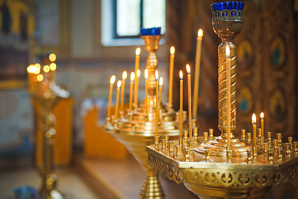 istock Burning candles in ortodox church 186813390