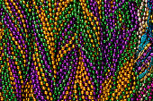 istock Close-up background of Mardi Gras beads 186813576