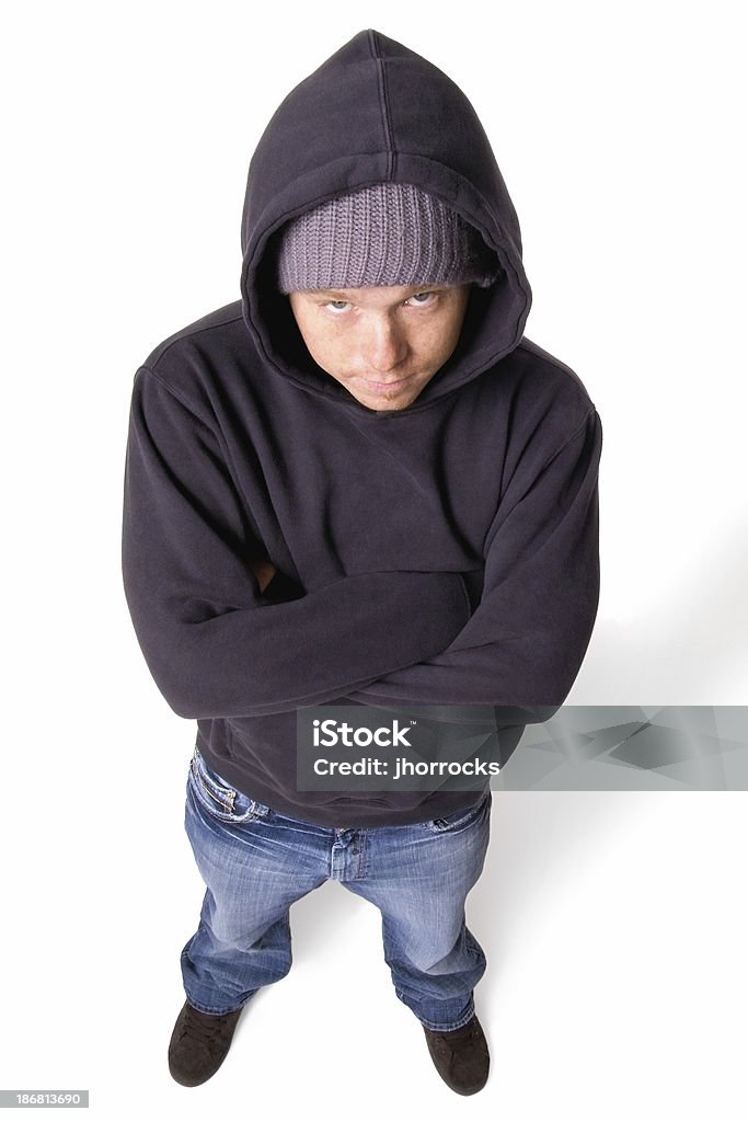 Teen Anxiety "Photo of a young man with arms folded, showing some attitude." High Angle View Stock Photo