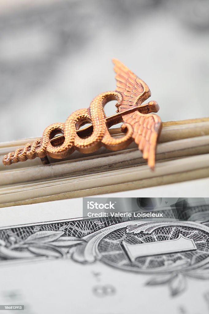 American Caduceus Caduceus with one us dollar bills. Currency Stock Photo