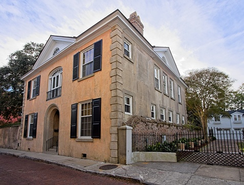 Charleston, South Carolina - USA, November 30, 2023. The preserved historic houses along Church street in old town Charleston South Carolina. Many houses from the 18th century during Colonial times along the narrow brick Church street in historic Charleston.