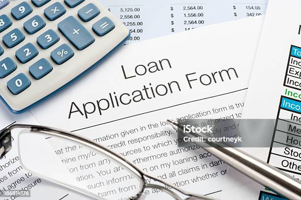 Loan Application Form With Pen Calculator Stock Photo - Download Image Now - Financial Loan, Application Form, Applying