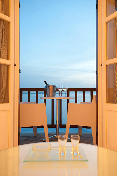 istock Two glasses of wine on a balcony 186814220