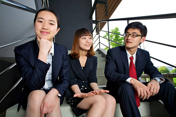 istock Young staffs sitting on the stairs 186814355