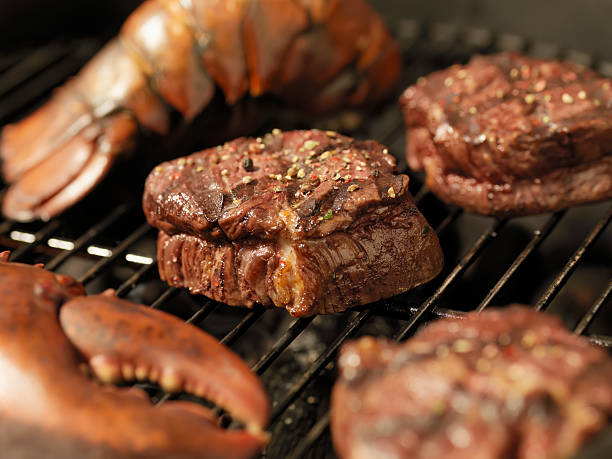istock Steak and Lobster on an outdoor BBQ 186814607