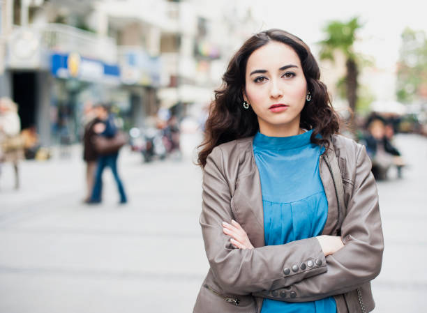 istock Young Woman Standing in Street 186814771
