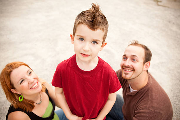 istock Happy, Young Family of Three Spending Time Outdoors Together 186814813