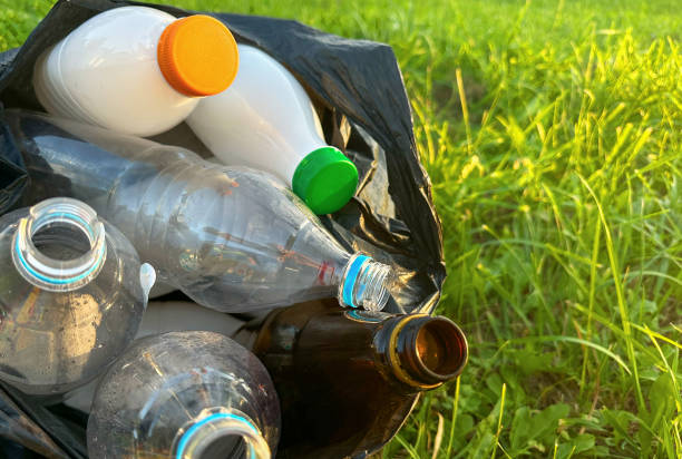 istock Plastic ollecting for recycling. Plastic caps and Lids plastic bottles in garbage bag for recycling. 1868148681