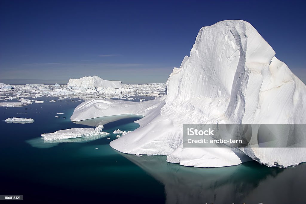 Antarctic Iceberg An ice berg in the Antarctic on a clear sunny day Antarctica Stock Photo