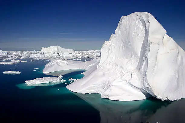 An ice berg in the Antarctic on a clear sunny day