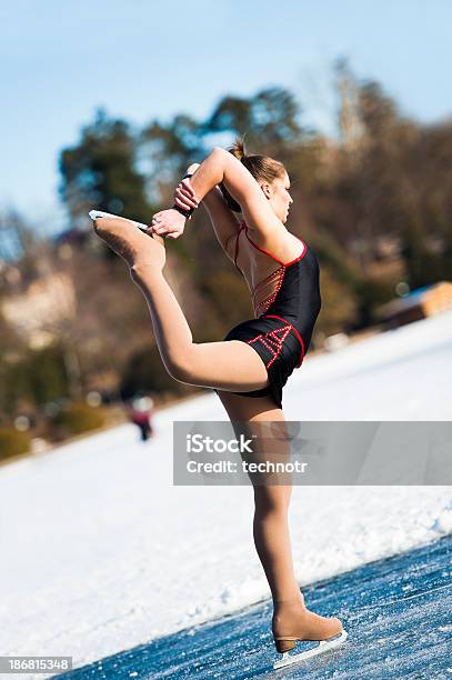 Attractive Female Ice Skating On Bled Lake Stock Photo - Download Image Now - Active Lifestyle, Activity, Adult