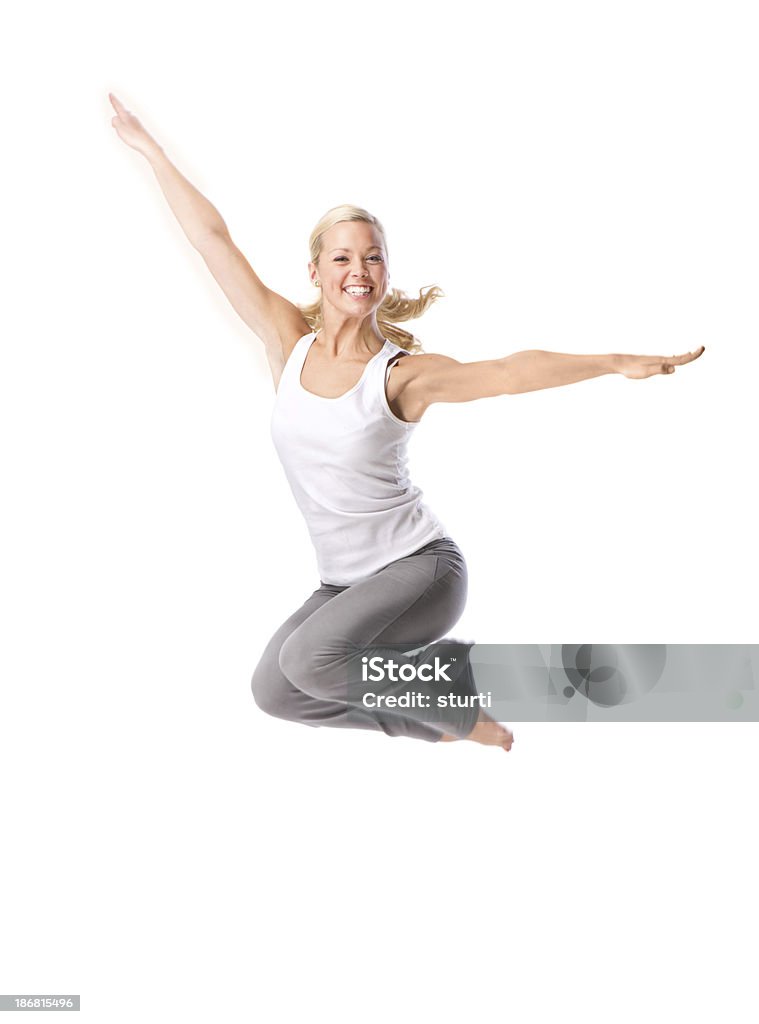young female jumping Active Lifestyle Stock Photo
