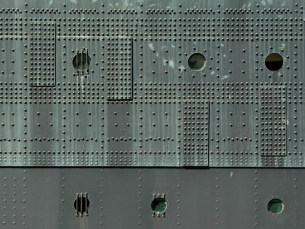 istock Rivets Portholes and Steel Hull of Ship 186815930