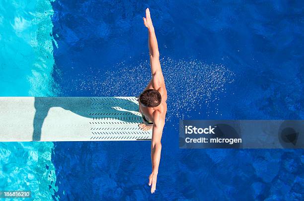 Springboard Diving Competitor Stock Photo - Download Image Now - Diving Board, High Angle View, Men