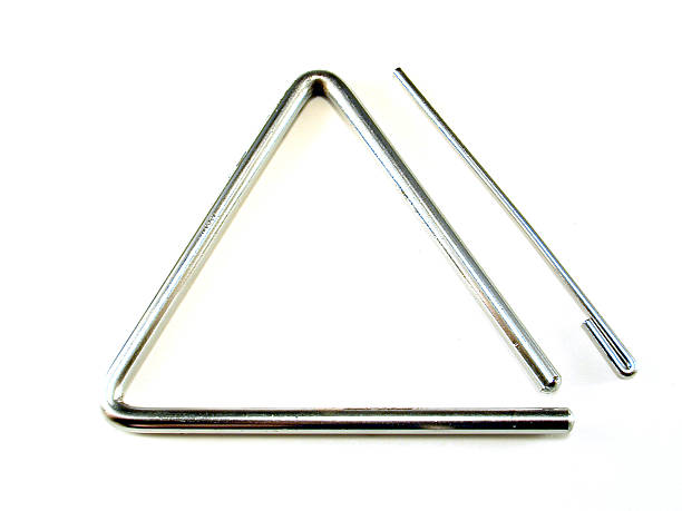 Triangle 2 A metal percussion instrument isolated on white.Check out all triangle percussion instrument stock pictures, royalty-free photos & images