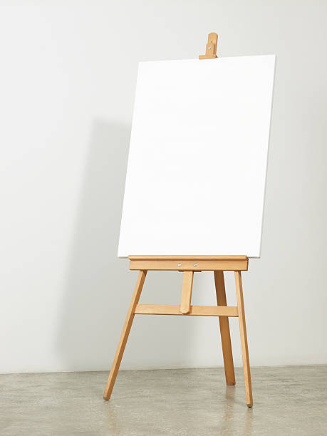 Easel with vertical canvas Easel with vertical canvas -clipping path- artists canvas stock pictures, royalty-free photos & images