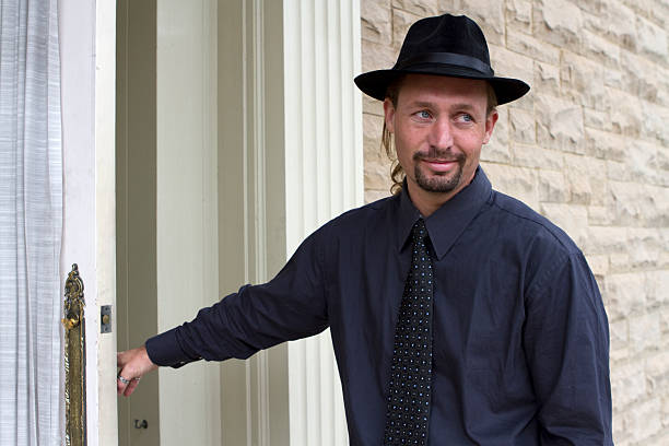 istock Horizontal Portrait of Handsome Man Entering His Home 186816773