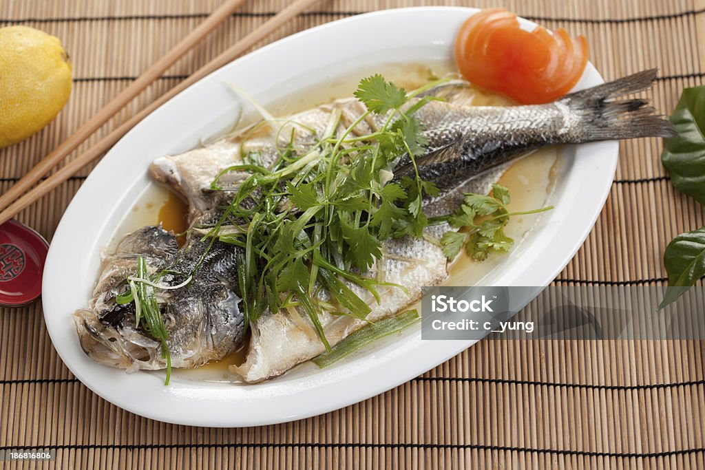steamed fish whole fish steamed on plate asian style Fish Stock Photo