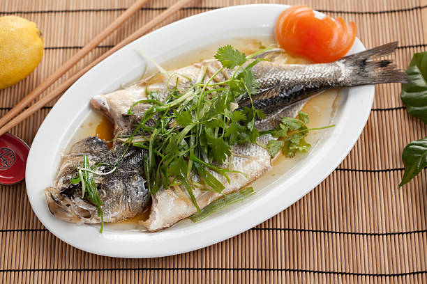 steamed fish whole fish steamed on plate asian style forelle pear stock pictures, royalty-free photos & images