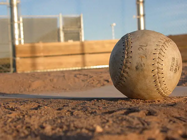 shot of softball on homeplate.See more related images in my Softball & Baseball lightbox: