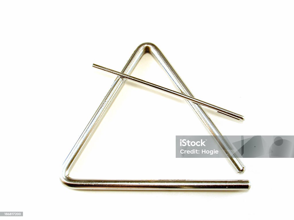 Triangle Percussion instrument; isolated on white.Check out all Triangle - Percussion Instrument Stock Photo