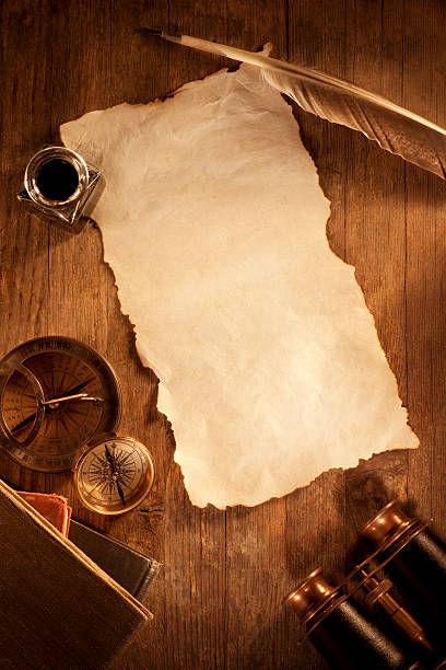istock Antique Paper on a Wooden Desk 186817318